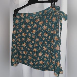 Size XS wrap skirt from American Eagle. Green with pink flowers.